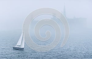 Boat in the sea in mist