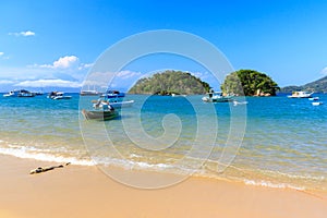 Boat sea mountains Abraao Beach of island Ilha Grande, Brazil