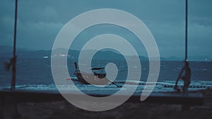 Boat in the sea over cloudy dark sky