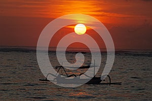 Boat on the sea during scenic sunset in the evening, Bali, Indonesia