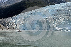 Boat from the ship Via Australis in the Bay of the Pia glacier.