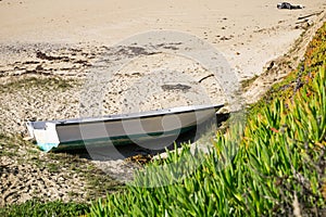 Boat shipwrecked on a beach, California