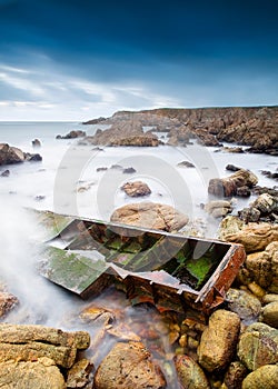 Boat shipwrecked on the coast