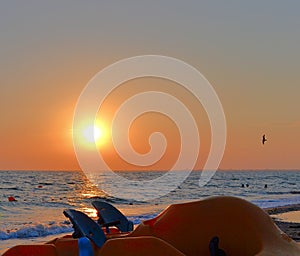 Boat on the shore under the evening sun