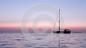 Boat silhoette at dawn in Ria Formosa. Algarve