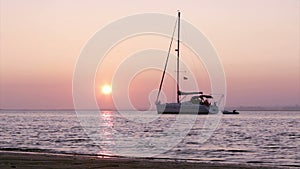 Boat silhoette at sunset in Ria Formosa. Algarve