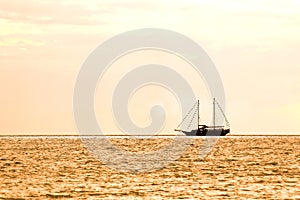 Boat silhouette at sunset