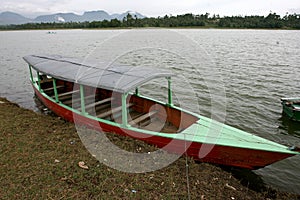 A boat in Situ Cileunca, Pangalengan, West Java, Indonesia. The atmosphere of Lake Cileunca photo
