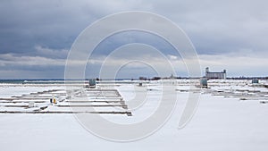 Boat slips are frozen in while the Lighthouse Point Marina in Collingwood