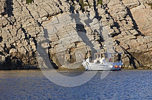 Boat in Sostis Bay. Cretan beach. Mediterranean sea. Greece