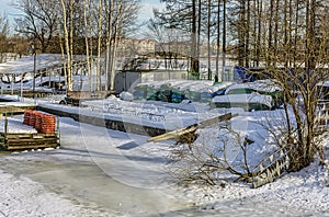 A boat station closed until spring on the banks of the Izhora River in Kolpino, St. Petersburg