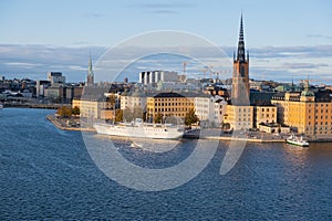Boat stays at Lake MÃ¤laren near Riddarholmen Church in Stockholm, Sweden