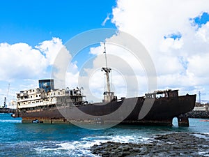 Boat stranded on the coast. Lanzarote, Spain, Europe. Lost Place