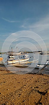 Boat and sunrise on Serangan Beach