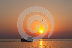 The boat at sunset, with tourists at sunset, swim under the scorching sun, a fabulous sea sunset