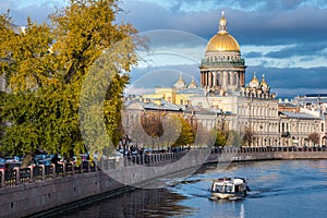 Boat tour along the Moyka River past Saint Isaac`s Cathedral Isaakievskiy Sobor in St. Petersburg, Russia