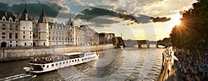 Boat tour on Seine river in Paris with sunset. Paris, France