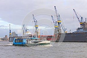 Boat with tourists goes on Elbe river in Hamburg, Germany