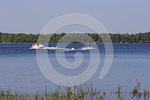 Boat Tows Waterskier on Bass Lake  703471