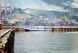 Boat traffic police moored to pier on the