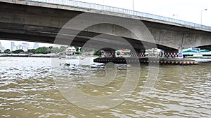 Boat Transportation on Chao Phraya River at Phra Pok Klao Bridge