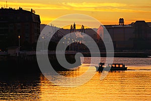 Boat transporting people at sunrise