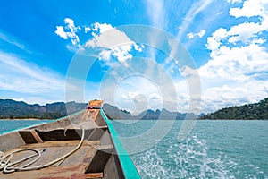 Boat travelling on a great lake in Thailand with speed, water splash