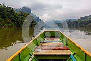 Boat travelling on Nam Ou river, La