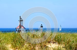 Boat travels Lake Michigan Besides St. Joseph Lighthouse