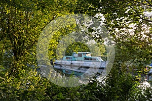 Boat through trees River Lea