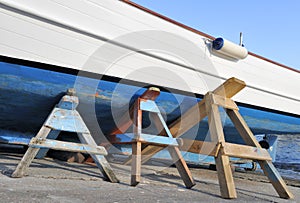 Boat on trestles in boatyard photo