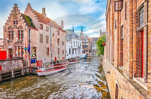 Boat trip on canal of Bruges. Popular for tourists who visit Belgium.