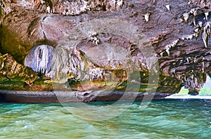 A boat trip through the grotto, Ko Thalu Ok Island, Phang Nga Bay, Thailand