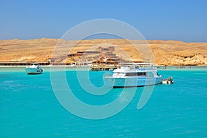 Boat trip on Red sea in Egypt and beautiful exotic landscape from Orange Bay island.