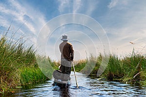 Boat trip in a traditional Makoro at the Okavango Delta, Botswana