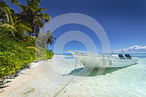 Boat and tropical beach in caribbean sea, Saona island, Dominican Republic
