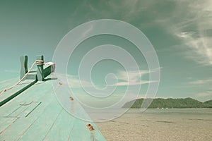 Boat in the tropical sea with blue sky background - vintage stye
