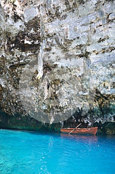 Boat in turquoise blue waters of Melissani cave