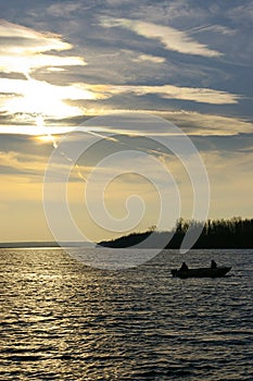 Fishing Fishermen On Lake With Scenic Sunset