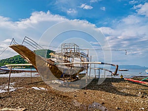 A boat under construction on a beach in the Philippines.
