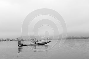 A boat using by people to travel from the other side of lake