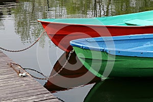 Boat, vacation, tourism, green and red boats parked ashore