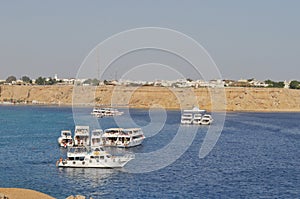 Boat with vacationers in the sea photo