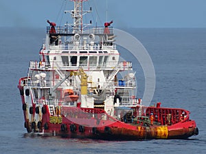 Boat waiting transfer cargo and passenger between oil and gas platform for hard work in offshore.