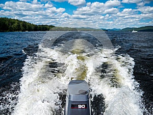 Boat wake with outboard engine