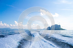 Boat wake prop wash on blue ocean sea