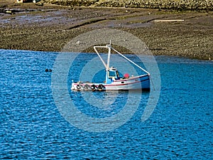Boat on Walney channel Cumbria photo