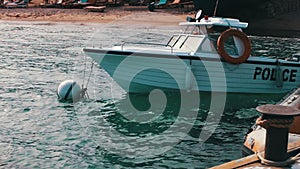 Boat water police moored near the shore in Red Sea