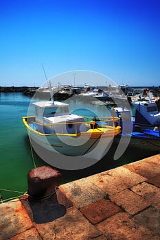 Boat with yellow accents at the quay