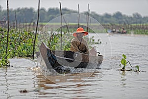 Boater along shores, Tonle Sap, Cambodia